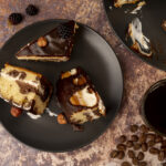 Decadent cheesecake brownies with creamy swirls and fudgy chocolate base.